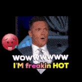 a man in a suit and tie is saying wow www i 'm freakin hot