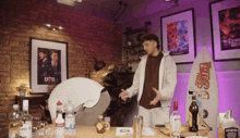 a bottle of bacardi sits on a table in a room