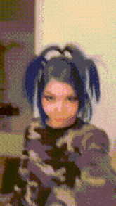 a pixel art of a girl with blue hair