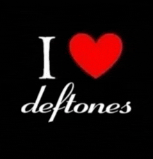a sign that says i love deftones with a red heart in the middle