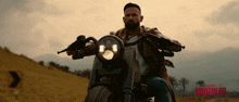 a man riding a motorcycle with the words black brothers written on the bottom