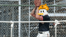 a pixelated image of a baseball player wearing a yellow hat with the number 0 on it
