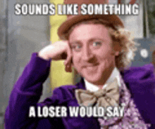a man in a purple suit and bow tie is making a funny face and saying sounds like something a loser would say