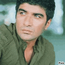 a close up of a man 's face with a pixiz watermark