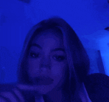 a blurry picture of a room with blue lights on the walls and ceiling