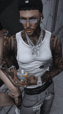 a man with a lot of tattoos holds a bottle of soda