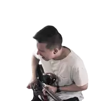 a man in a white shirt playing a guitar