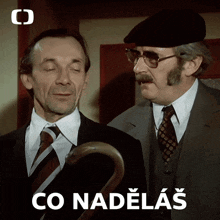 two men are standing next to each other with a cane and the words co nadelas on the bottom