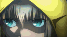 a close up of a person with blue eyes and a yellow hood
