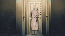 a man in a trench coat is standing in front of a door with a cane .