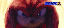 a close up of knuckles from the movie sonic the hedgehog looking at the camera .