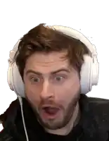 a man with a surprised look on his face wears headphones