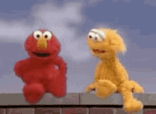 Lol Elmo GIF - Lol Elmo Shrug GIFs