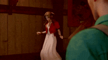 a man is standing next to a woman in a red dress in front of a mirror .