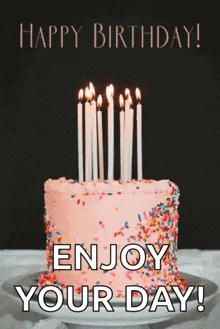 a birthday cake with candles and sprinkles with the words happy birthday enjoy your day written on it