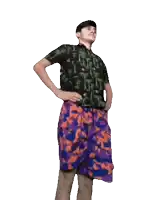 a man in a black shirt and purple shorts is dancing