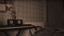 a black and white photo of a bedroom with a calendar hanging on the wall that says december och