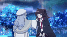 a girl in a cape stands next to another girl