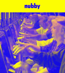 a group of people are playing slot machines and the word nubbly is on the bottom