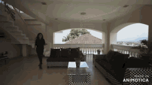 a woman walking down a staircase in a living room made in animotica