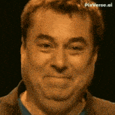 a close up of a man 's face with a funny face .