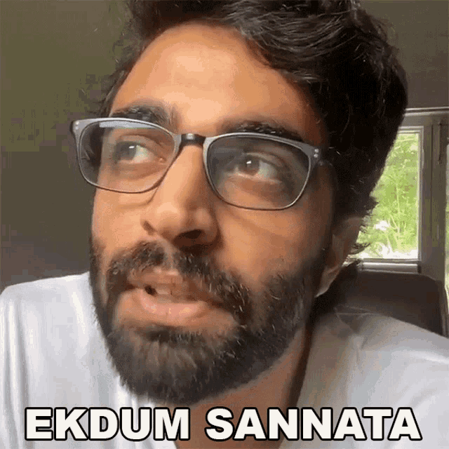 a man with glasses and a beard says 