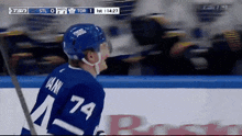 a hockey player wearing a number 74 jersey