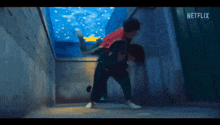 a man is carrying another man on his back in a netflix video .