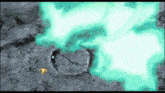 a green light is coming out of a hole in the ground .