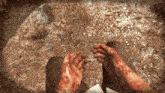 a person 's hands are covered in blood in a video game scene