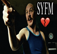 a man in a blue tank top is pointing at something with syfm written on the bottom
