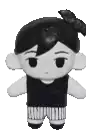 a black and white stuffed doll with a bow on its head .