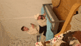 a man laying on a bed looking at his phone