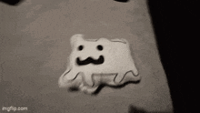 a black and white drawing of a ghost with a mustache on a wall .