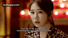 a woman in a leopard print shirt says your life is like a boat that is traveling the seas with just one sail .