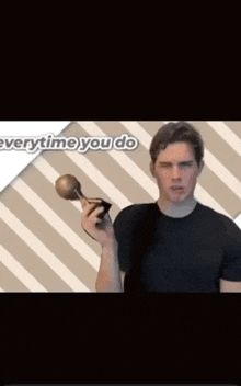 a man in a black shirt is holding a trophy in front of a striped background that says " everytime you do "
