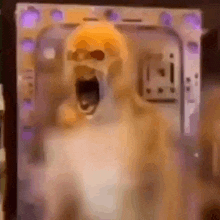 a dog is standing in front of a computer case with its mouth wide open .
