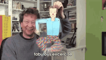 a man is holding up a paper doll with the words fabulous excercise below him