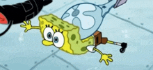 a cartoon spongebob is laying on his back on the floor