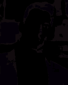 a blurry picture of a man standing in the dark