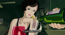 a woman is sitting at a table with a glass of wine and a bottle of wine that says i just feel numb on it