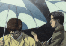 two men are holding umbrellas in the rain and one of them is wearing sunglasses