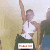 a woman in a white top and black skirt is dancing with the name eva pacheco on the bottom