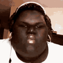 eating big guy chewing headphones looking