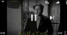 a black and white video of a man is being played on a phone