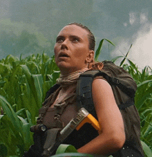 a woman with a backpack is holding a hammer