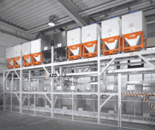 a warehouse with a fence and a sign that says azo on it