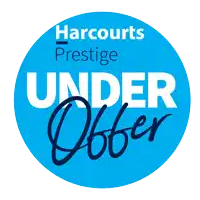 a blue circle with the words harcourts prestige under offer