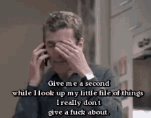Malcolm Tucker Peter Capaldi GIF - Malcolm Tucker Peter Capaldi Give Me A Second While I Look Up My Little File GIFs