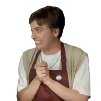 a woman wearing an apron has a button on her shirt that says " i am a transgender "